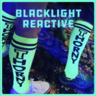 THORNY shiggy socks glowing in black light